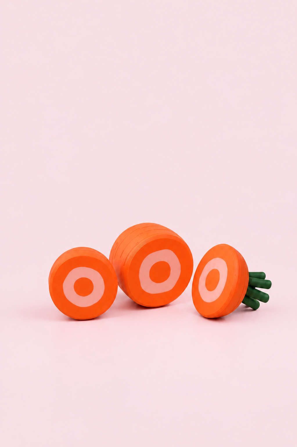 NestfulGold play toy on a pale pink background