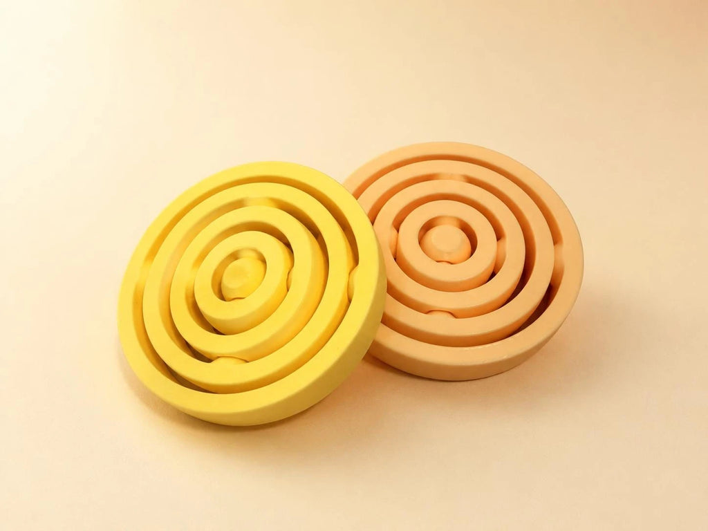 Yellow and orange air spinners side by side