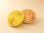 Yellow and orange air spinners side by side