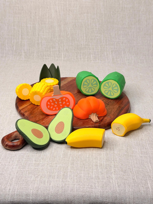 Mixed magnetic produce designs separated on a display board