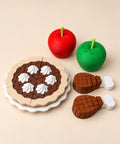 Chocolate pie with two turkey legs and two apples